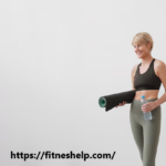 a woman holding a yoga mat