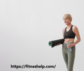 a woman holding a yoga mat