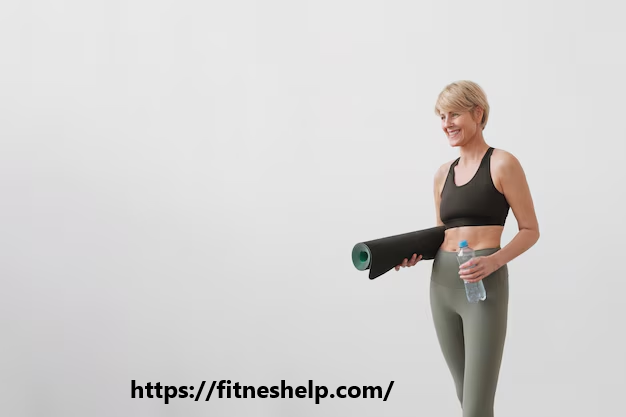 a woman holding a yoga mat